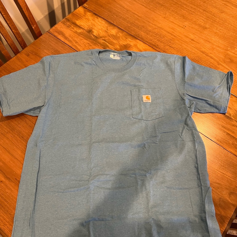 Worn once Carhartt shirt in new spring color.